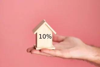 An image of a hand holding the house.