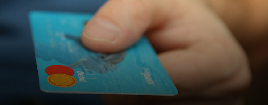 A credit card in a man`s hand.